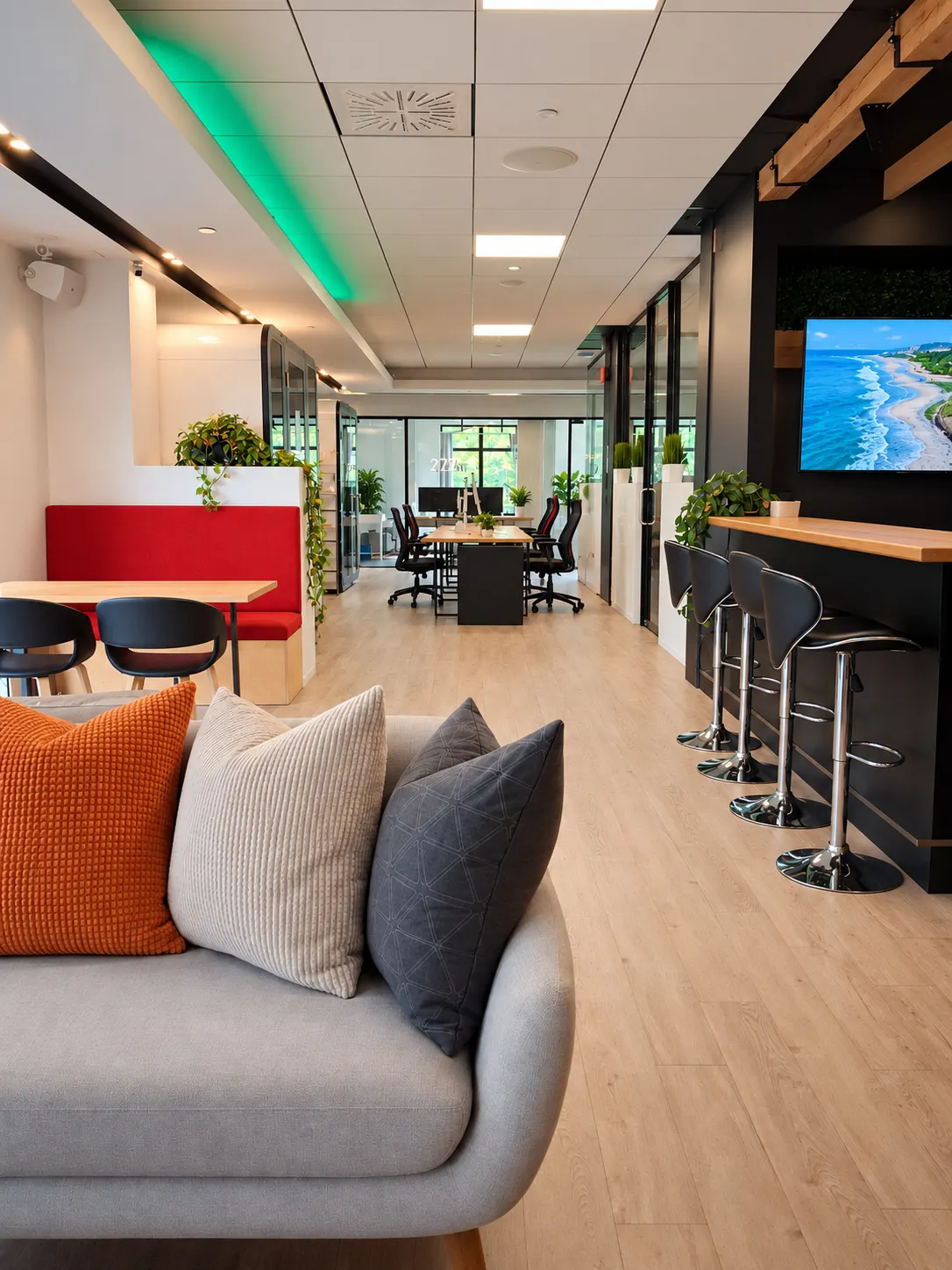 Lounge at 2727 Coworking in Griffintown, with the bar, the meeting table and private offices behind
